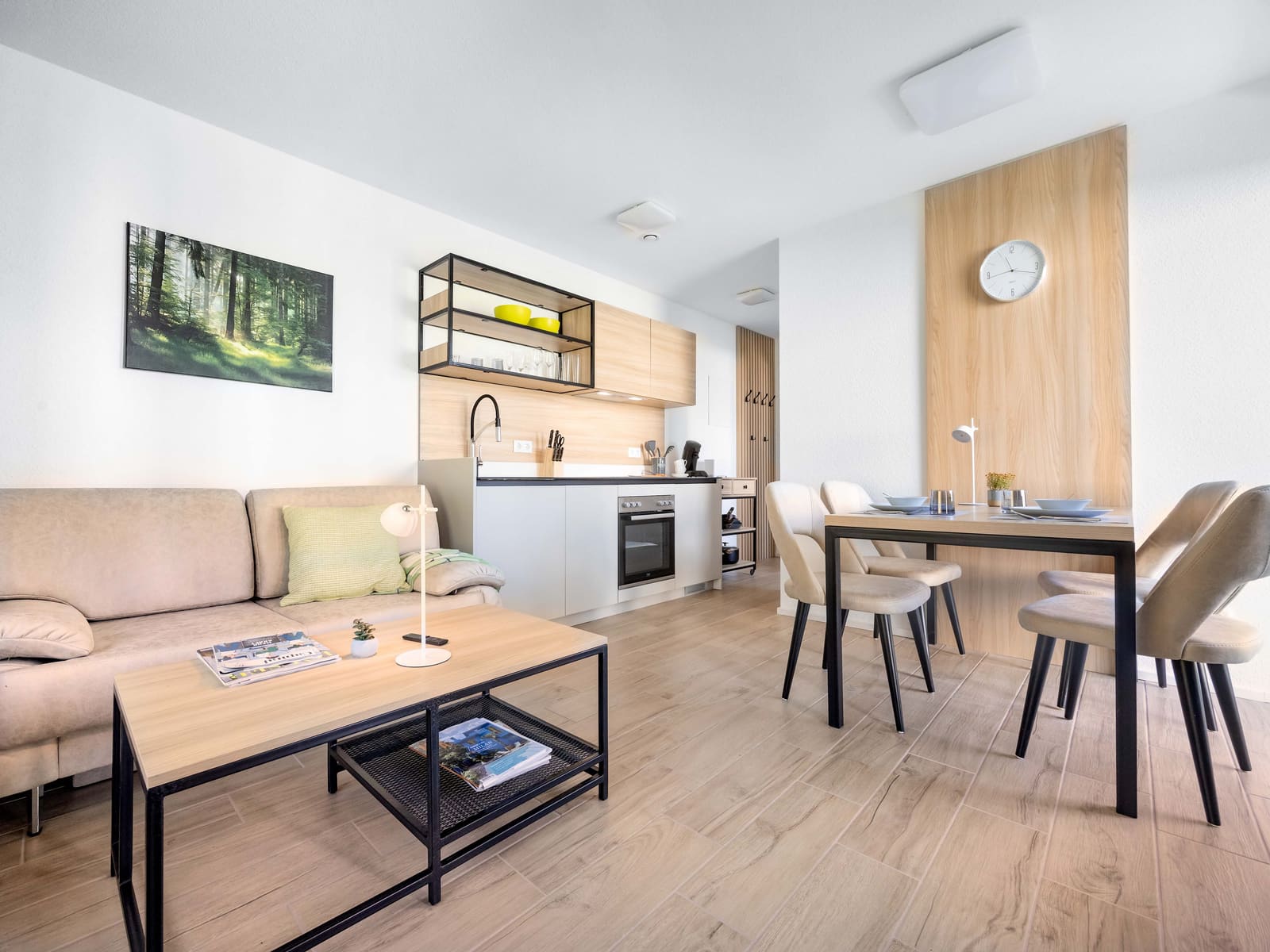 Living space with kitchen, dining table and sofa